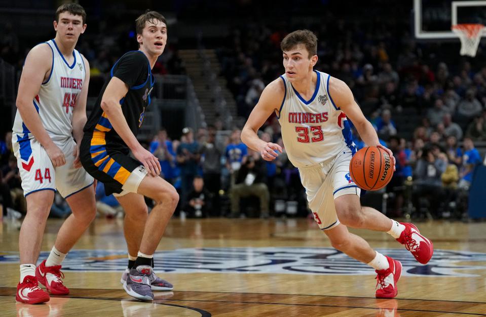 Linton-Stockton Miner Joey Hart (33) (right) works the ball down the court during IHSAA Class 2A state finals Saturday, March 25, 2023, at Gainbridge Fieldhouse in Indianapolis. Fort Wayne defeated Linton-Stockton for the title, 52-45.