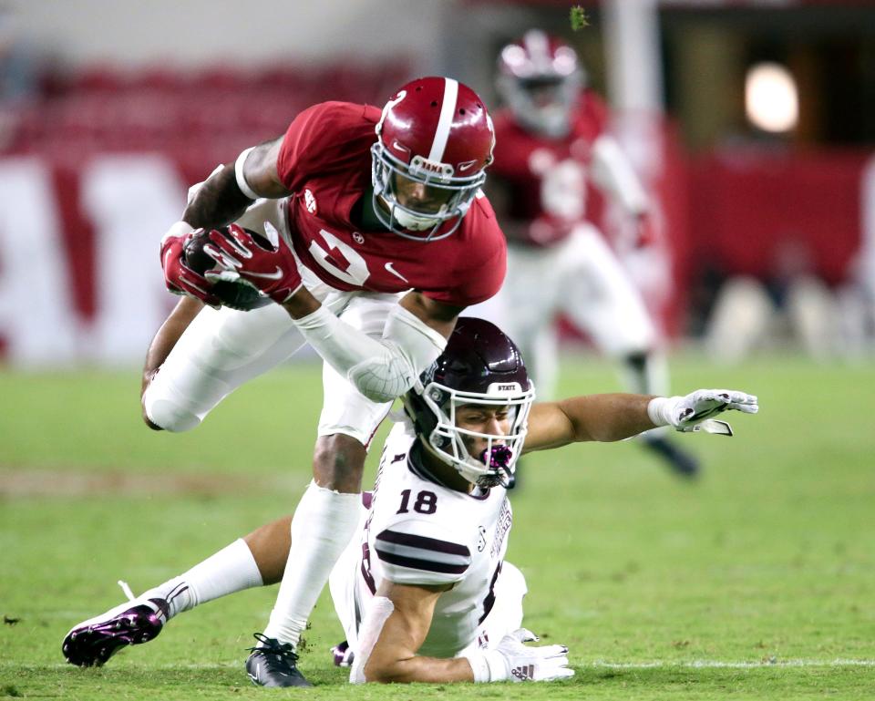 FILE - Alabama defensive back Patrick Surtain II (2) makes an interception that he returned for a touchdown against Mississippi State during the second half of an NCAA college football game in Tuscaloosa, Ala., in this Saturday, Oct. 31, 2020, file photo. Surtain used Alabama's first pro day on Tuesday, March 23, 2021, to show he deserves to be considered at the top of a very competitive class of draft picks. Surtain, rated as the top cornerback in the draft, posted unofficial times of 4.42 and 4.44 seconds in the 40-yard dash before NFL scouts and coaches at Alabama's indoor practice facility. (Gary Cosby Jr.//The Tuscaloosa News via AP, File)