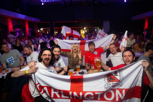 Football fans watch David Baddiel, Frank Skinner and Lighting Seeds performing (David Parry/PA)