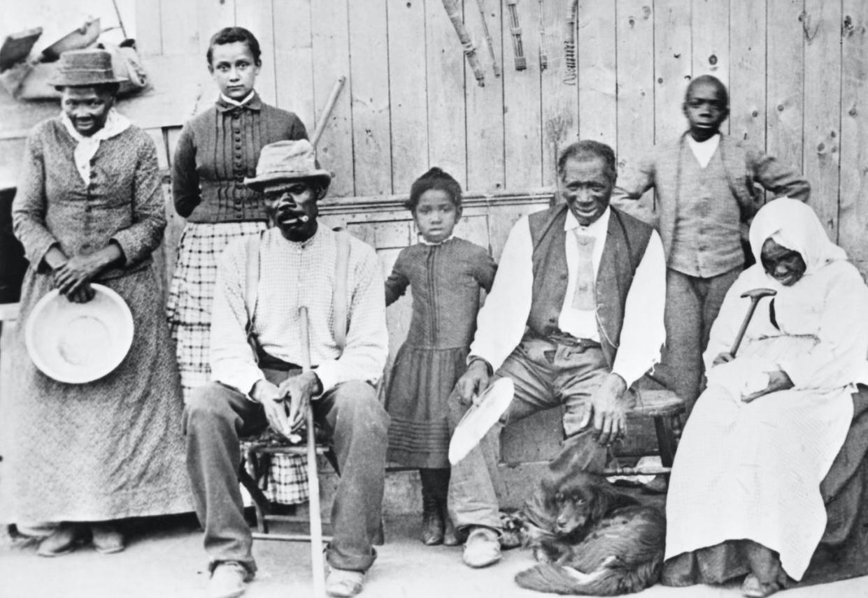 <span class="caption">Tubman, left, with a few of the former slaves she helped escape. </span> <span class="attribution"><a class="link " href="https://www.gettyimages.com/detail/news-photo/harriet-tubman-photographed-with-a-group-of-slaves-whose-news-photo/514885176" rel="nofollow noopener" target="_blank" data-ylk="slk:Bettmann/Getty Images;elm:context_link;itc:0;sec:content-canvas">Bettmann/Getty Images</a></span>