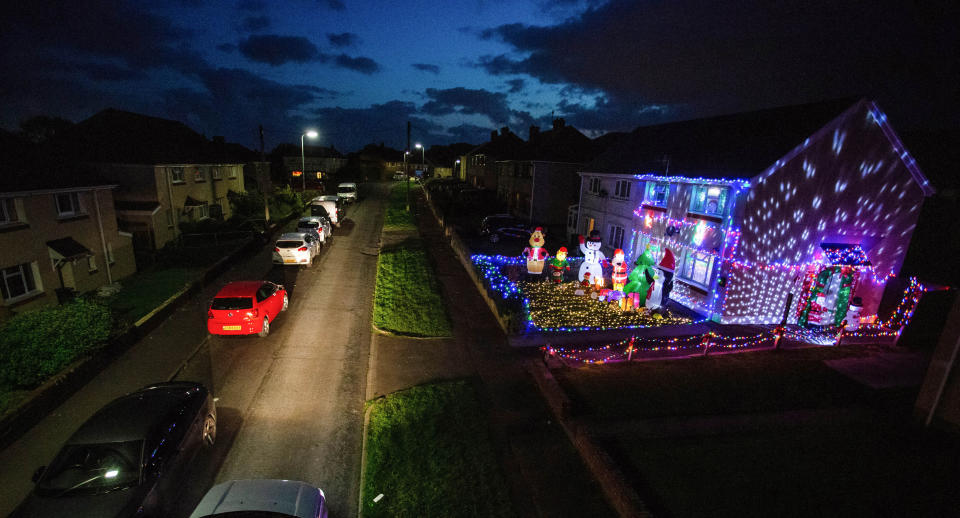 A mum has gone all out to cheer up her kids and neighbours by putting up her CHRISTMAS decorations three months early - including 3,000 outdoor lights. Caroline Gabe, 46, has been shielding with her children since March - and said putting up her tree and decorations in September was a much-needed boost. She has spent the year buying outdoor lights and installations - from as far away as America - and put them all up last week, on a whim. Almost all of them are outside - including 3,000 fairy lights, sparkling snow, an 8ft inflatable snowman, as well as Santa and his reindeer.