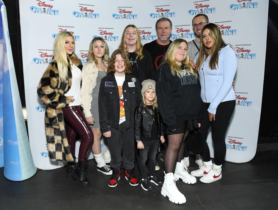 Tori Spelling (L), Dean McDermott (back 2nd R), and kids Liam, Finn, Stella, Beau, Hattie, Jack, and Lola arrive as Disney On Ice presents Road Trip Adventures at Crypto.com Arena on December 09, 2022 in Los Angeles, California.  (Jon Kopaloff / Getty Images)