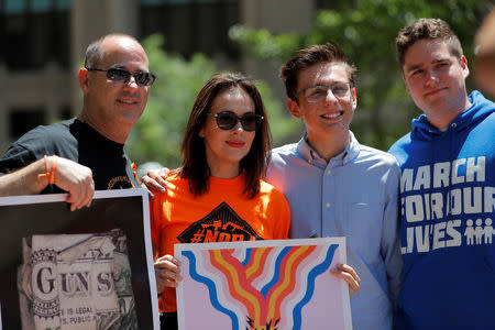 Actor Alyssa Milano poses with gun control advocates while taking part in a gun control protest outside of the annual National Rifle Association (NRA) convention in Dallas, Texas, U.S., May 5, 2018. REUTERS/Lucas Jackson