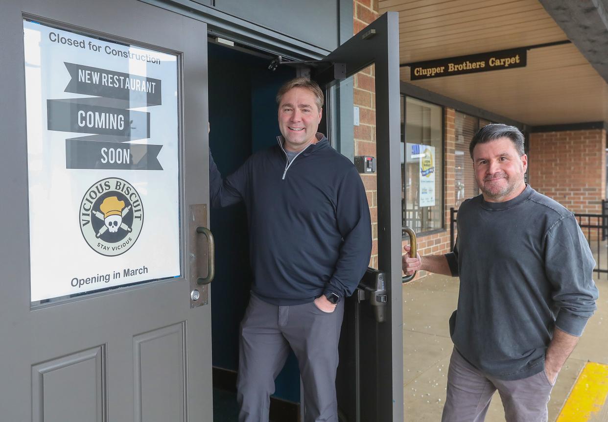 Vicious Biscuit partners Dave Ost, left, and Carl Albright will soon be opening a franchise at Montrose Centre in Copley.
