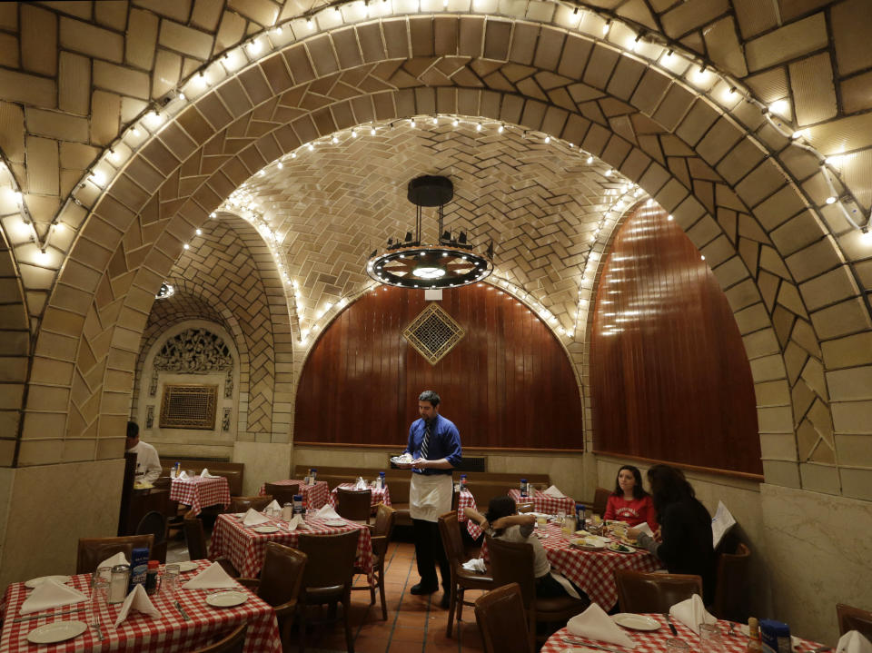 FILE - In this Jan. 9, 2013 file photo, tiled and vaulted ceilings designed by the Gustavino company forms decor for the Oyster Bar restaurant in New York's Grand Central Terminal. Rafael Guastavino and his son Rafael Jr., who designed many of New York City’s most treasured buildings and public spaces using their patented system of structural tile vaults, are the subjects of the new exhibition "Palaces for the People: Guastavino and the Art of Structural Tile," a new exhibition opening March 26, 2014, at the City Museum. (AP Photo/Kathy Willens, File)