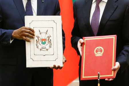 China's Foreign Minister Wang Yi and Burkina Faso Foreign Minister Alpha Barry attend a signing ceremony establishing diplomatic relations between the two countries in Beijing, China, May 26, 2018. REUTERS/Thomas Peter/Pool