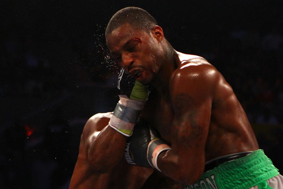 ATLANTIC CITY, NJ - APRIL 28: Chad Dawson takes a punch to the face from Bernard Hopkins during their WBC & Ring Magazine Light Heavyweight Title fight at Boardwalk Hall Arena on April 28, 2012 in Atlantic City, New Jersey. (Photo by Al Bello/Getty Images)