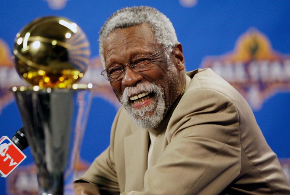 NBA great Bill Russell reacts at a news conference as he learns the most valuable player award for the NBA basketball championships has been renamed the Bill Russell NBA Finals Most Valuable Player Award, Feb. 14, 2009, in Phoenix.