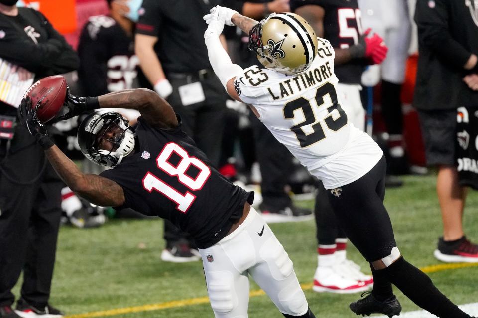 Atlanta Falcons wide receiver Calvin Ridley (18) makes a catch against New Orleans Saints cornerback Marshon Lattimore (23) during a game Dec. 6 in Atlanta.