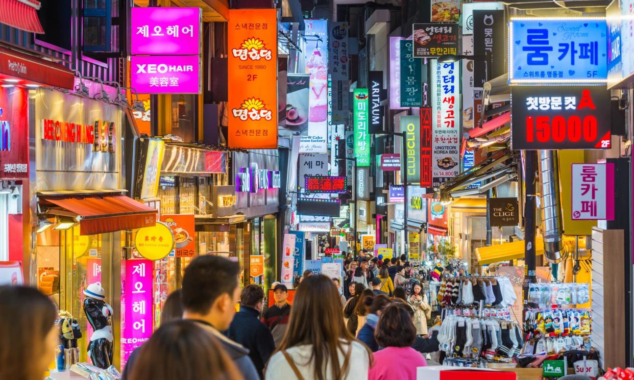 <span>The Myeongdong neighbourhood in Seoul at night.</span><span>Photograph: fotoVoyager/Getty Images</span>