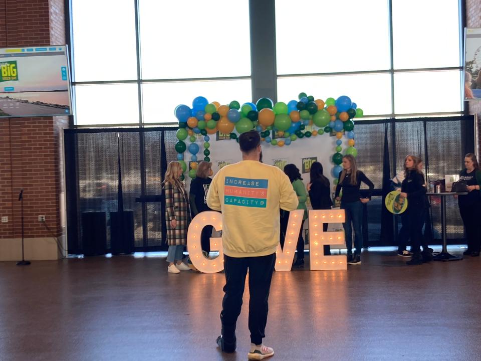 Alex Rodriguez, the CEO of Happily Ever After, takes photo of group at the seventh annual Give Big Green Bay event Wednesday at Johnsonville Tailgate Village in Ashwaubenon, Wisc.