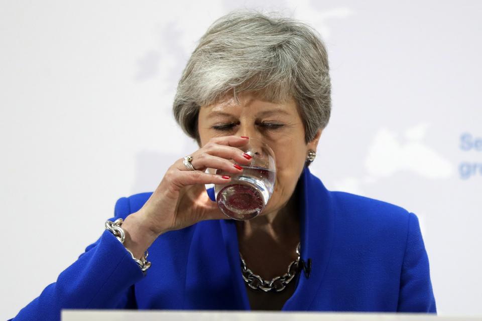 Britain's Prime Minister Theresa May drinks water during a speech in London, Tuesday, May 21, 2019. The British government is discussing how to tweak its proposed European Union divorce terms in a last-ditch attempt to get Parliament's backing for Prime Minister Theresa May's deal with the bloc. (AP Photo/Kirsty Wigglesworth, pool)