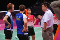 LONDON, ENGLAND - JULY 31: An official speaks to Greysia Polii and Meiliana Jauhari of Indonesia in their match with Jung Eun Ha and Min Jung Kim of Korea during their Women's Doubles Badminton during Badminton match on Day 4 of the London 2012 Olympic Games at Wembley Arena on July 31, 2012 in London, England. (Photo by Michael Regan/Getty Images)