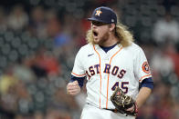 Houston Astros relief pitcher Ryne Stanek reacts after striking out Texas Rangers' Adolis Garcia during the eighth inning of a baseball game Thursday, May 13, 2021, in Houston. (AP Photo/David J. Phillip)