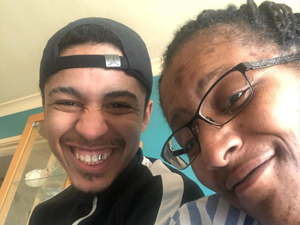 Ricardo smiles with his mother (Family Supplied)