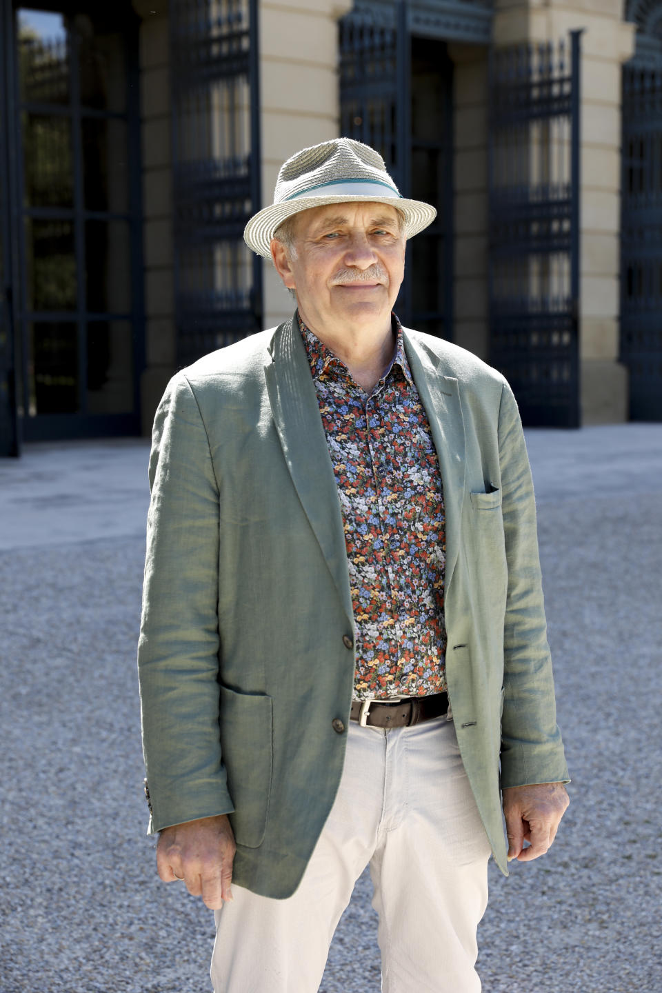 The Austrian artist and author Gerhard Ruiss poses for a portrait prior to an interview about his initiative 'Frauenmorde – Es geht uns alle an" which means "Femicide- It Concerns Us All" in Vienna, Austria, Tuesday, May 11, 2021. Austria is one of the few European Union countries where the number of women killed is higher than the number of men. The recent high-profile cases have led to widespread protests, demands for government intervention and condemnations from top politicians. (AP Photo/Lisa Leutner)