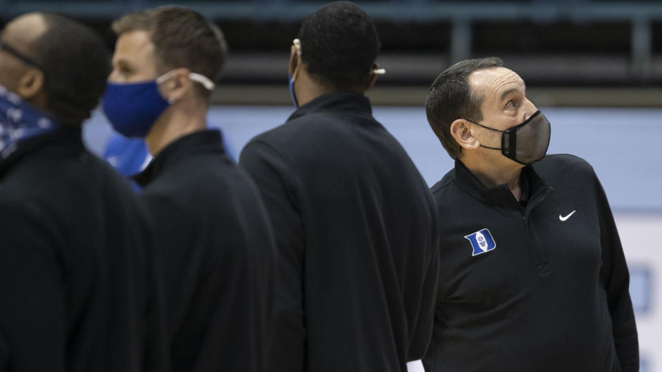 Duke coach Mike Krzyzewski lines with his players for for the national anthem for the team's NCAA college basketball game against North Carolina on Saturday, March 6, 2021, in Chapel Hill, N.C. (Robert Willett/The News & Observer via AP)