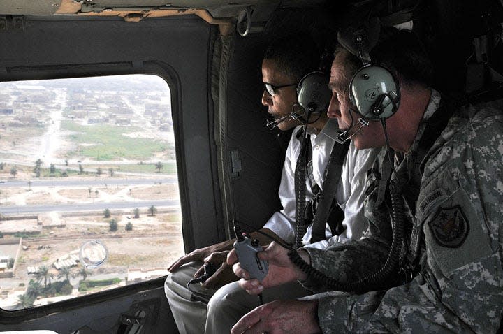 In this photo released by the U.S. army, U.S. presidential candidate Barack Obama, left, and top U.S. military commander in Iraq, David Petraeus, ride inside a helicopter in Baghdad, Iraq, Monday, July 21, 2008. Obama began Monday his first on-the-ground inspection of Iraq since launching his bid for the White House, with U.S. commanders ready to brief him on progress in a war he long opposed and Iraqi leaders wanting more details of his proposals for troop withdrawals. (AP Photo/Ssg. Lorie Jewell, HO)