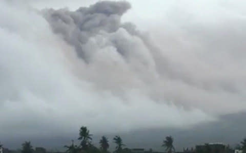 Clouds of ash engulf the volcano in Legazpi - Credit: Reuters