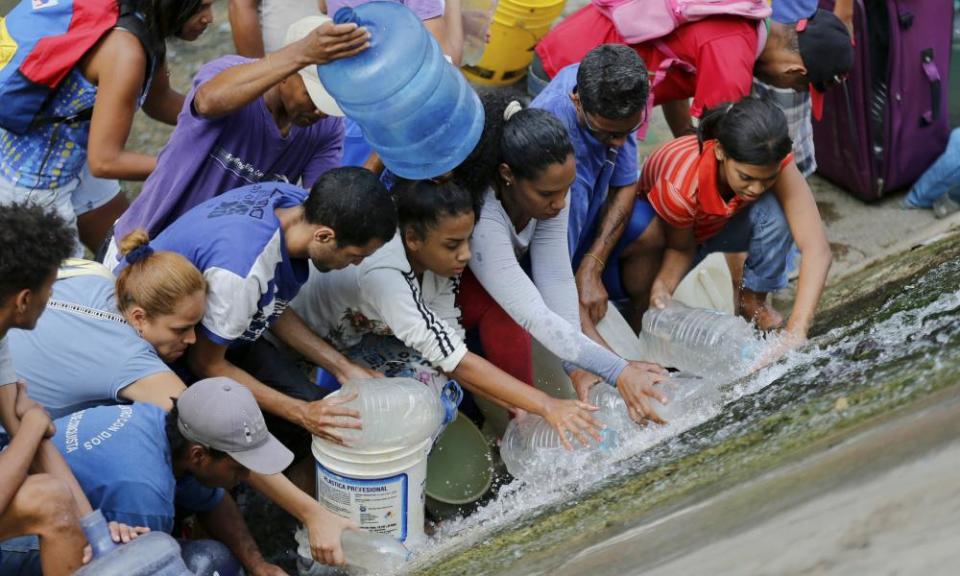 <span>People in Venezuela collect water from a leaking pipe during rolling blackouts, which affects access to running water in Caracas. Russia has blamed the US for the power crisis.</span> <span>Photograph: Fernando Llano/AP</span> <p>Russia has accused the United States of deliberately causing a succession of crippling power cuts in Venezuela as part of a plot to topple its president, Nicolás Maduro, dubbed “Operation Blackout”.</p> <p>The crisis-stricken South American country has been rocked by a series of nationwide power outrages since 7 March, which Maduro’s government has blamed on <a rel="nofollow noopener" href="https://www.theguardian.com/world/2019/mar/28/venezuela-blackout-latest-news-maduro-sniper-prayers" target="_blank" data-ylk="slk:US-backed saboteurs and snipers;elm:context_link;itc:0;sec:content-canvas" class="link ">US-backed saboteurs and snipers</a> but most experts attribute to poor maintenance and <a rel="nofollow noopener" href="https://www.theguardian.com/world/2019/mar/14/venezuela-blackout-power-returns" target="_blank" data-ylk="slk:a bush fire;elm:context_link;itc:0;sec:content-canvas" class="link ">a bush fire</a> that destroyed a key section of Venezuela’s power grid.</p> <p>In <a rel="nofollow noopener" href="https://www.rt.com/news/457242-moscow-security-conference-sovereignty-threats/" target="_blank" data-ylk="slk:an interview;elm:context_link;itc:0;sec:content-canvas" class="link ">an interview</a> with the Moscow-funded broadcaster RT, however, Russia’s deputy defence minister, Alexander Fomin, backed Maduro’s version of events.</p> <p>Fomin claimed Washington felt reluctant to launch an outright military operation against Maduro, fearing it “might rally the nation behind the current government” and anger other Latin American governments.</p> <p>But the US was not a country to “sit idly [by]”, Fomin added. Instead, it was “employing … a broad range of techniques” in its effort to remove Maduro, including a “man-made shutdown of [Venezuelan] energy facilities”.</p> <p>“Operation Blackout is underway,” Fomin was quoted as saying.</p> <p>The Russian report was approvingly <a rel="nofollow noopener" href="https://twitter.com/telesurenglish/status/1120454553676275712" target="_blank" data-ylk="slk:reproduced;elm:context_link;itc:0;sec:content-canvas" class="link ">reproduced</a> by Telesur, Maduro’s main international propaganda outlet.</p> <p>Russia’s claim contradicts widespread consensus among specialists and Maduro’s political rivals that Hugo Chávez’s authoritarian heir is in fact responsible for an unprecedented electricity crisis that has deprived millions of citizens of light and water.</p> <p>In a recent interview with the Guardian, Henrique Capriles, a prominent opposition leader involved in the campaign to unseat Maduro, called claims the blackouts were part of an anti-Maduro plot “a fantasy”.</p> <p>“I don’t know what is worse – having no electricity or the government’s explanation … They must think all Venezuelans are fools,” he said.</p> <p>Capriles, who <a rel="nofollow noopener" href="https://www.theguardian.com/world/2013/apr/16/protests-venezuela-capriles-nicolas-maduro" target="_blank" data-ylk="slk:narrowly lost the 2013 presidential election to Maduro;elm:context_link;itc:0;sec:content-canvas" class="link ">narrowly lost the 2013 presidential election to Maduro</a>, predicted the blackouts would continue because of the damage inflicted on Venezuela’s electricity system through years of corruption.</p> <p>“If I could sit down with Maduro now, I’d say: ‘You are a disaster, mate,’” he added.</p> <p>Exactly three months after the push to unseat Maduro began – on 23 January – he remains in power and retains the support of both Russia and China.</p> <p>Juan Guaidó, the opposition leader who most western nations have recognised as Venezuela’s rightful interim president, <a rel="nofollow noopener" href="https://www.reuters.com/article/us-venezuela-politics-guaido/venezuelas-guaido-calls-for-largest-march-in-history-to-oust-maduro-idUSKCN1RV17V" target="_blank" data-ylk="slk:last week summoned;elm:context_link;itc:0;sec:content-canvas" class="link ">last week summoned</a> “the largest march in the history of Venezuela” for 1 May in an bid to keep up the pressure at a time when some fear his campaign is fading.</p>