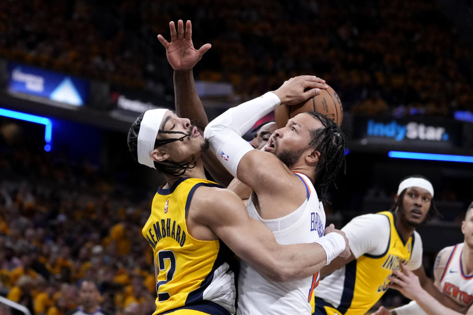 Indiana Pacers guard Andrew Nembhard, left, is fouled by New York Knicks guard Jalen Brunson during the first half of Game 3 in an NBA basketball second-round playoff series, Friday, May 10, 2024, in Indianapolis. (AP Photo/Michael Conroy)