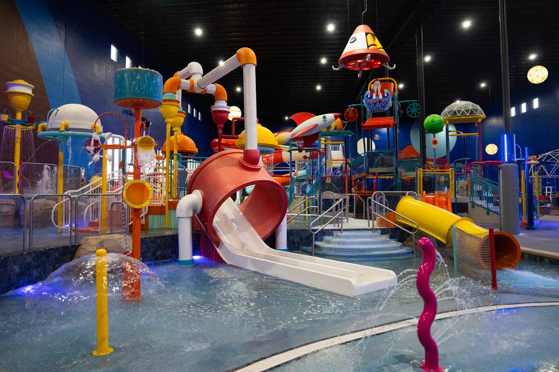 In addition to a dual surf machine, which allows two people to surf at once, there is a lazy river, a hot tub, a swim-up bar, a swimming area and 11 slides at the new Blast Off Bay water park in Goddard.