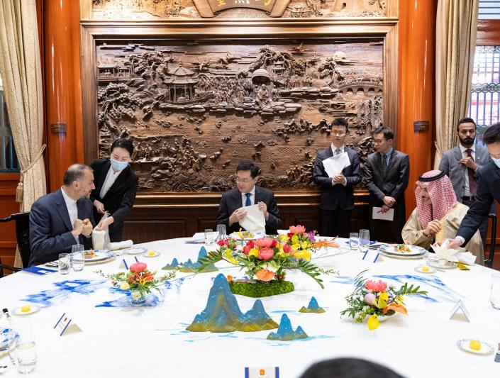 Iran-Saudi diplomatic meeting with Chinese official at table