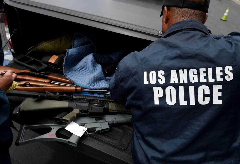 Rifles and assault rifles among a batch of thirteen that were exchanged for gift cards are seen during a Los Angeles Police Department and Mayor's Office of Gang Reduction and Youth Development sponsored gun buyback event in Los Angeles, California on May 7, 2016. The city held the event in two locations and the public were able to safely and anonymously surrender firearms in exchange for $100 and $200 gift cards.<span class="copyright">Mark Ralston—AFP/Getty Images</span>
