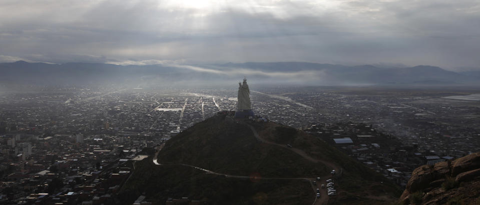 A large statue of the Virgin Mary stands on Santa Barbara hill overlooking the mining city of Oruro, Bolivia, as it is unveiled on Friday, Feb. 1, 2013. The statue, known in Spanish as "Virgen del Socavón," or the Virgin of the Tunnel, is Oruro's patron, venerated in particular by miners and folkloric Carnival dancers. To withstand Bolivia's high plains' strong winds, the statue that stands at 45 meters (147 feet) was constructed with cement, metal and fiberglass. (AP Photo/Juan Karita)