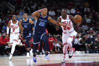 Memphis Grizzlies' Desmond Bane (22) fouls Chicago Bulls' Javonte Green during the first half of an NBA preseason basketball game Friday, Oct. 15, 2021, in Chicago. (AP Photo/Charles Rex Arbogast)