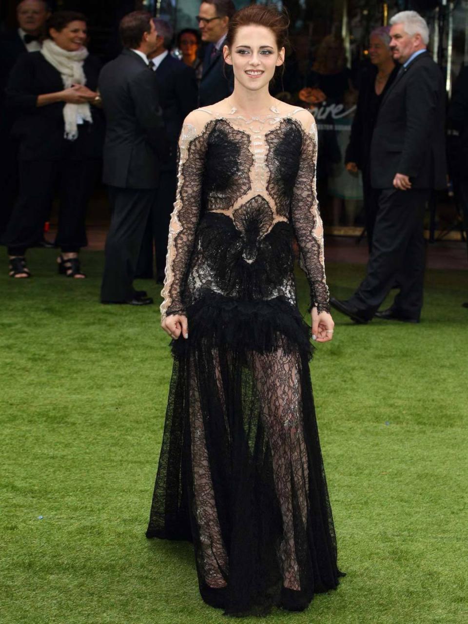 <p>Kristen Stewart wears a Marchesa gown with exquisite lace detailing for the premiere of Snow White and The Huntsman premiere in London, May 2012.</p>