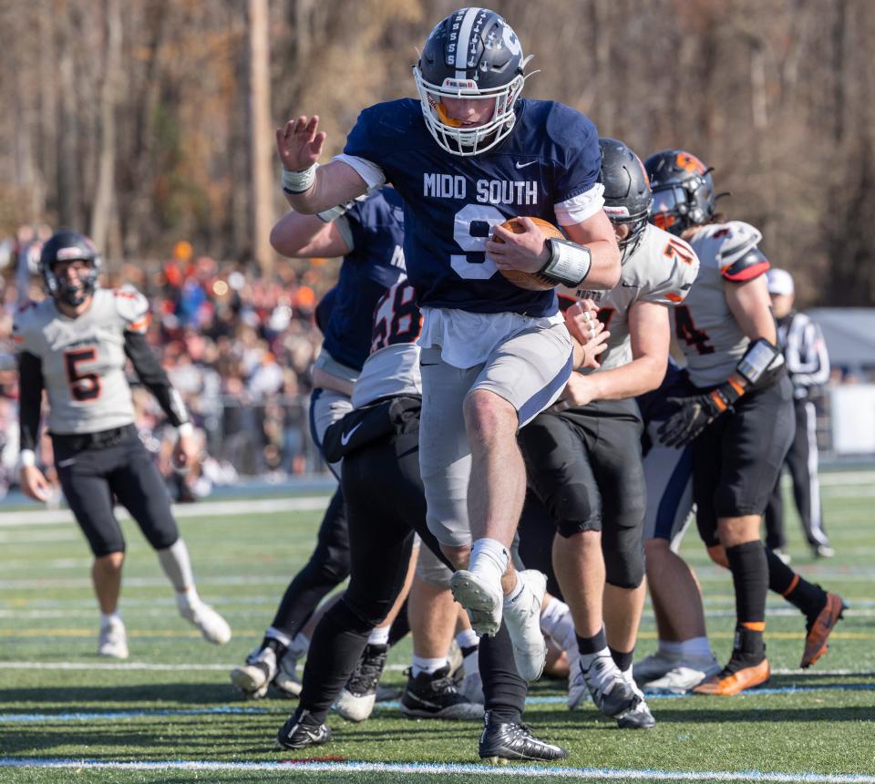 South Colin Gallagher goes airborn as he heads into the end zone for a touchsown. Middletown South defeats Middletown North in Thanksgiving Day game on November 24, 2022 in Middletown NJ. 