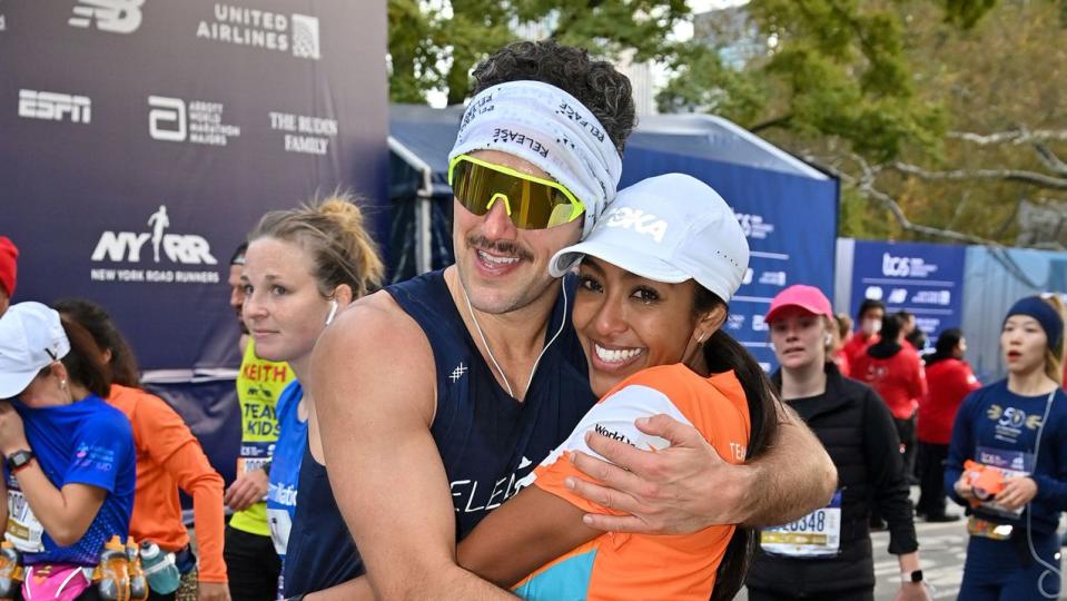 Zac Clark and Tayshia Adams are seen during the 2021 TCS New York City Marathon on November 07, 2021 in New York City