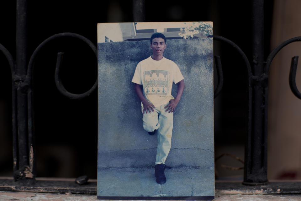 This Oct. 31, 2018 photo shows an undated family photo of Wilmer Gerardo Nunez as a young adult, at his mother's home in the Ciudad Planeta neighborhood of San Pedro Sula, Honduras. Eight years ago, at the age of 35, Nunez left Honduras for the United States, only to disappear in Mexico, leaving his anguished mother in limbo. (AP Photo/Moises Castillo)