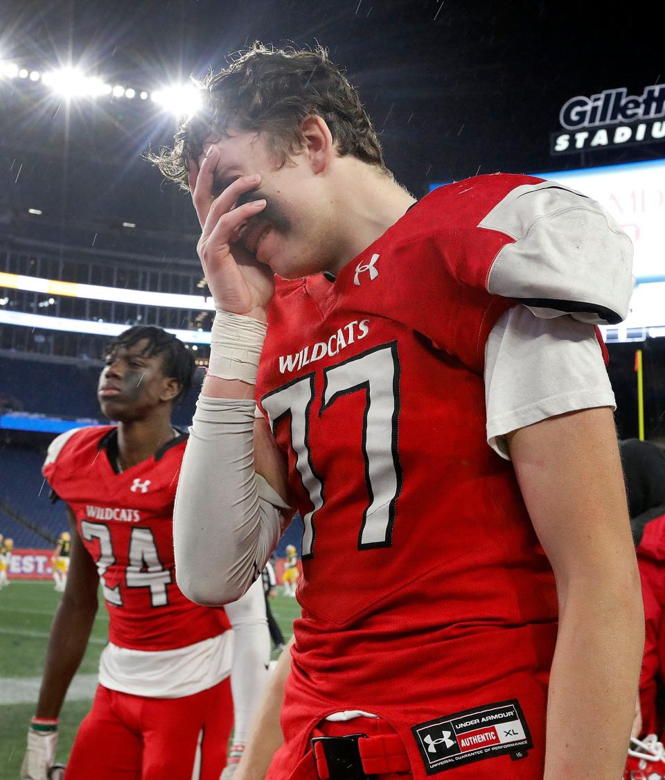 Milton senior Liam Flaherty tries to hold back his emotions after the loss.Milton suffers its first loss of the season to Wakefield 34028 in the MIAA state championship at Gillette Stadium on Saturday December 3, 2022.