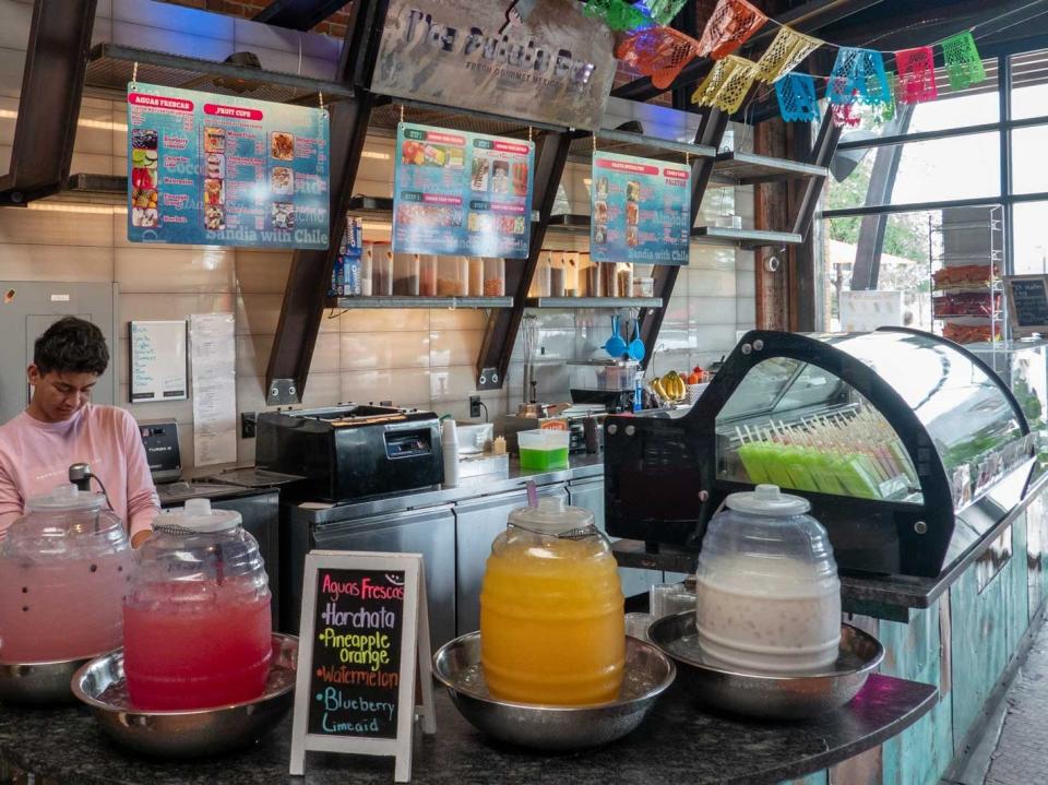 A paletas store with brighly colored decorations.