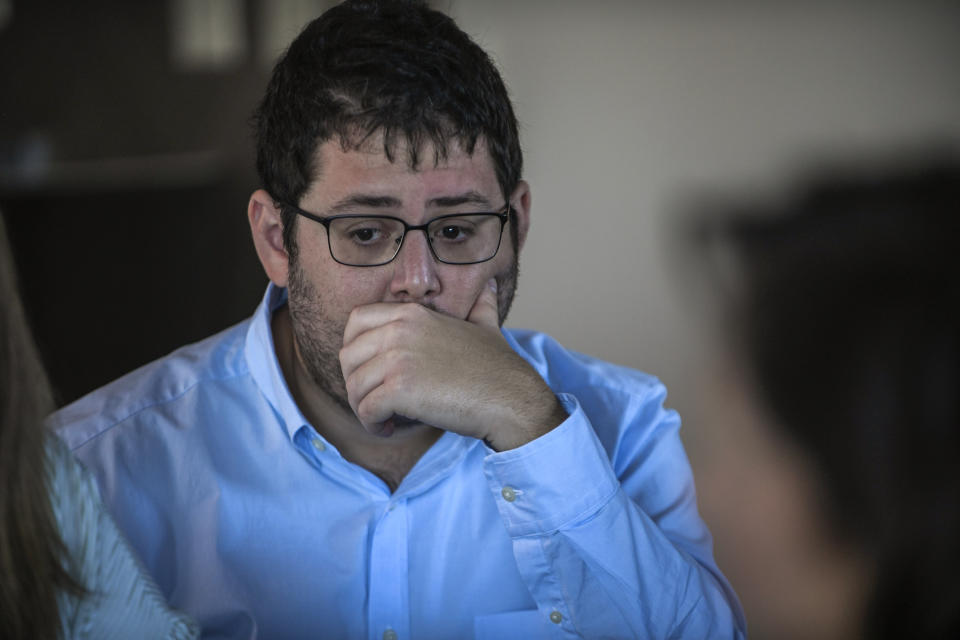 Aaron Eisen takes a moment to reflect after hearing the story of his grandfather, Holocaust survivor George Salton, at a gathering for families of Holocaust survivors, Sunday, Sept. 26, 2021, in East Brunswick, N.J. (AP Photo/Brittainy Newman)