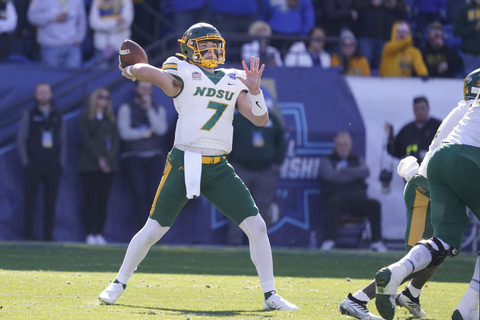 CORRECTS TO NORTH DAKOTA STATE NOT NORTH DAKOTA - North Dakota State quarterback Cam Miller (7) drops back to pass during the first half of the FCS Championship NCAA college football game against South Dakota State, Sunday, Jan. 8, 2023, in Frisco, Texas. (AP Photo/LM Otero)
