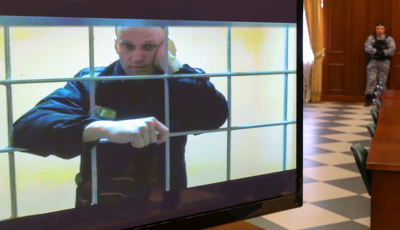 FILE PHOTO: Jailed Russian opposition leader Alexei Navalny is seen on a screen during a court hearing in Moscow