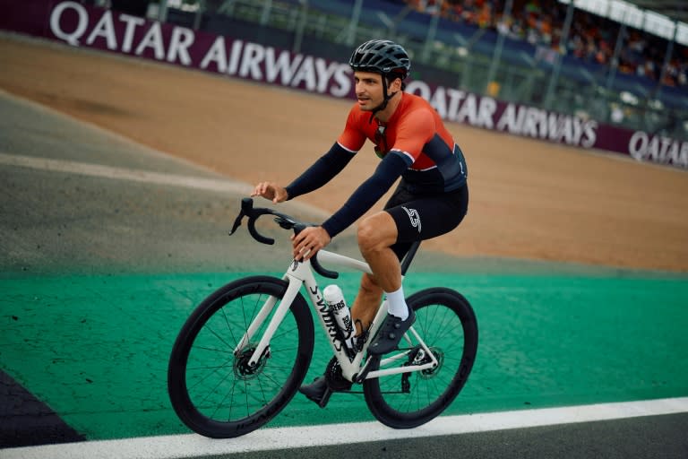 Pedal power: Carlos Sainz relaxing on a bike at Silverstone on Thursday as he stresses over his future (BENJAMIN CREMEL)