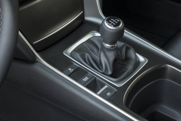 A close-up of the gearshift in a 2018 Honda Accord Sport equipped with six-speed manual transmission