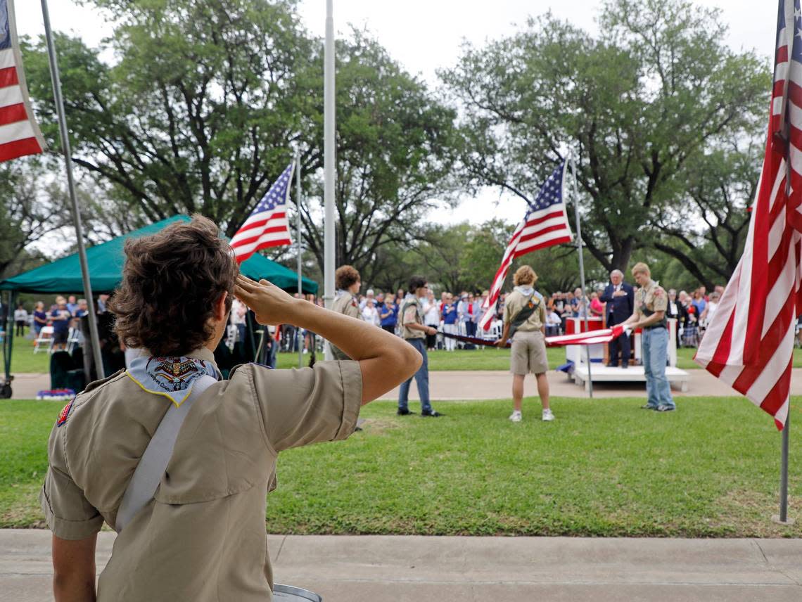 May 30, 2022: Members of Longhorn Council troop 50, including Drake Callaway, 17, Carson Callaway, 15, Rob Muckleroy, 15, Samuel Meyn, 17, and Nickolas Brown, 15, retire the flag after the 93rd Fort Worth Memorial Day Service at Mount Olivet Cemetery. Bob Booth/Special to the Star-Telegram