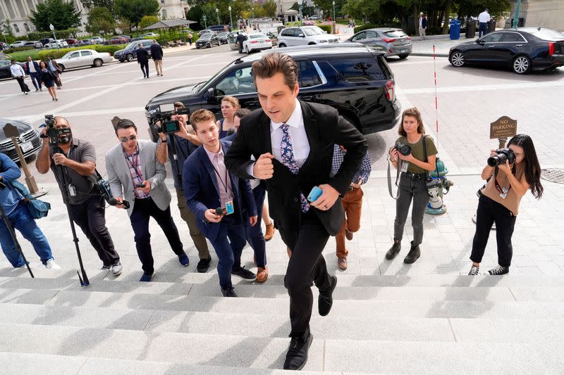 U.S. Representative Matt Gaetz runs up the East Capitol stairs