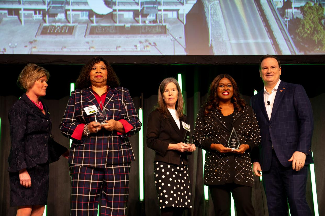 Hamilton County Commissioners Stephanie Summerow Dumas, Denise Driehaus, and Alicia Reese receive the Wendel P. Dabney Spirit Award announced by Jeff Berding during the Visit Cincy annual meeting at the Duke Energy Convention Center in Cincinnati on Wednesday, Jan. 31, 2024.