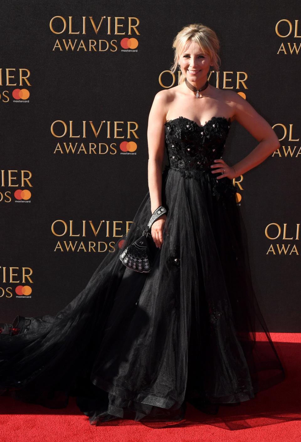 <p>The soap star turned up in a dramatic dark gown.<br><i>[Photo: PA]</i> </p>