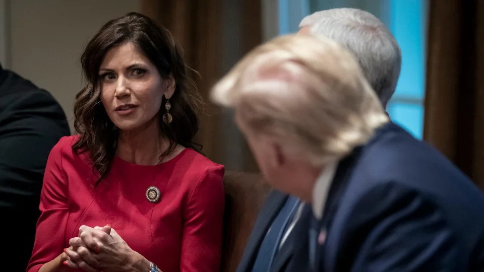  (L-R) Governor of South Dakota Kristi Noem speaks as U.S. President Donald Trump listens during a meeting about the Governors Initiative on Regulatory Innovation in the Cabinet Room of the White House on December 16, 2019 in Washington, DC. President Trump encouraged further action to reduce unnecessary regulations that the administration says are holding back American businesses. (Photo by Drew Angerer/Getty Images)