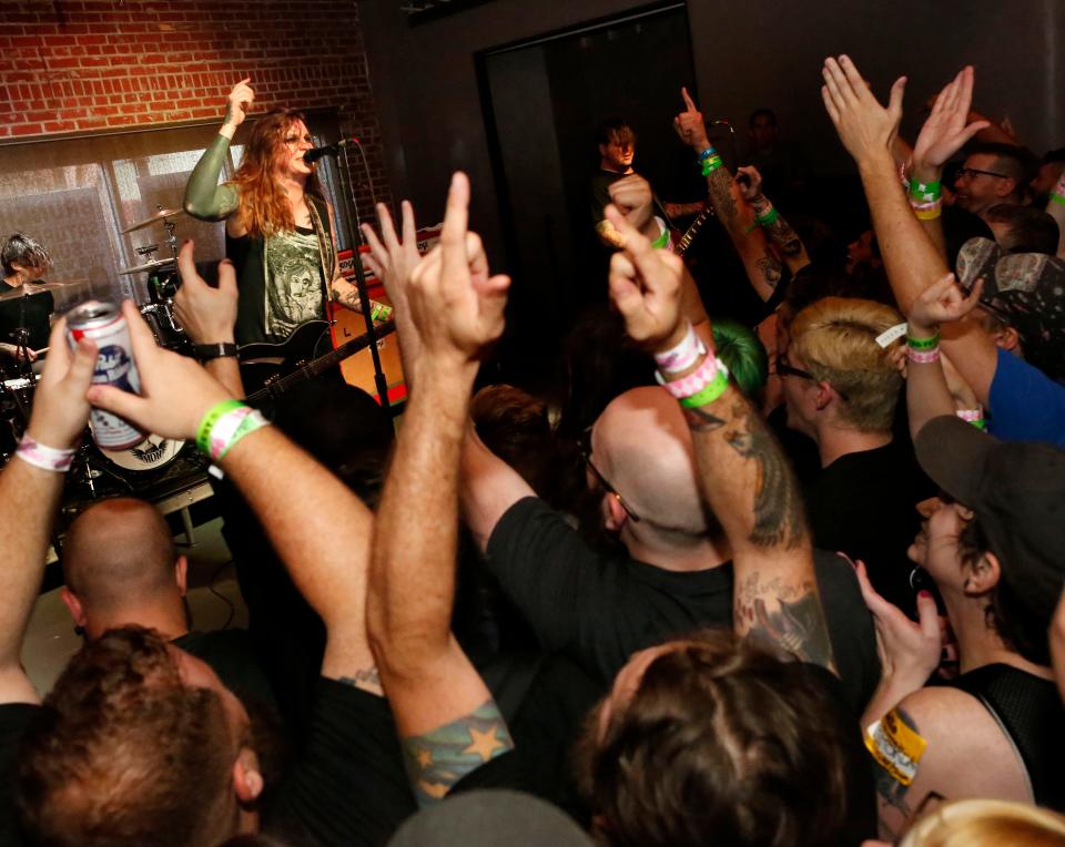 Laura Jane Grace of Against Me! sings as fans cheer during the band's first performance at TheFest 16 at the Wooly in Gainesville on Oct. 27, 2017. The Fest, an annual punk rock music festival, kicked off the weekend with Pabst Blue Ribbon beer and hard-hitting bands like Against Me!, The Flatliners and Hot Water Music.
