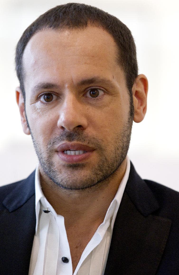 Salvatore Ferragamo's creative director, Massimiliano Giornetti, talks during an interview with the Associated Press, in Paris, Thursday, June 14, 2012. (AP Photo/Jacques Brinon)