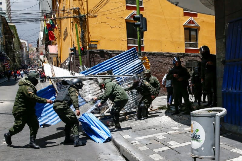 Members of the security forces set up a barricade as supporters of former Bolivian President Evo Morales march in La Paz