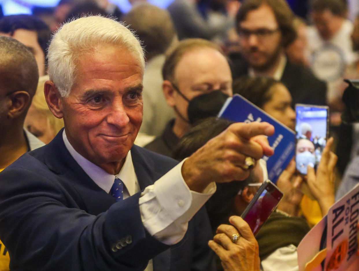 Rep. Charlie Crist greets supporters after addressing them from the podium at his watch party in the Grand Bay Ballroom of the Hilton St. Petersburg Bayfront Hotel, on Tuesday, Aug. 23, 2022, in St. Petersburg, Fla. (Dirk Shadd/Tampa Bay Times via AP)